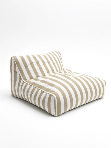 Driftwood Dune floating bean bag lounger in tan and white stripes, featuring a low-profile, armless design for relaxed outdoor coastal living.