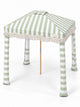 House of Dune Salted Sage beach cabana from a raised three-quarter angle, showing the striped roof panels, central vent, fringe and four fabric legs.