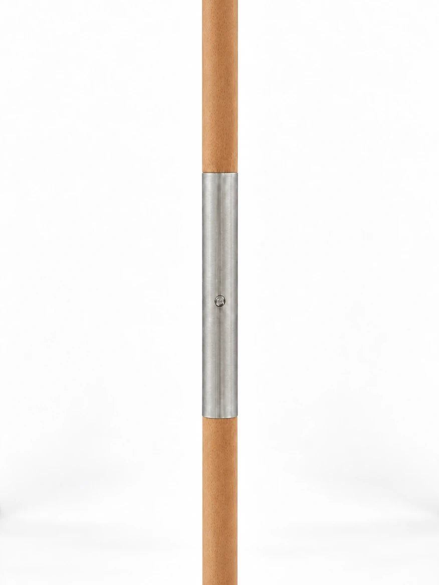 Wooden centre pole of the House of Dune Salted Sage cabana with its silver joining sleeve, where the two pole sections connect.