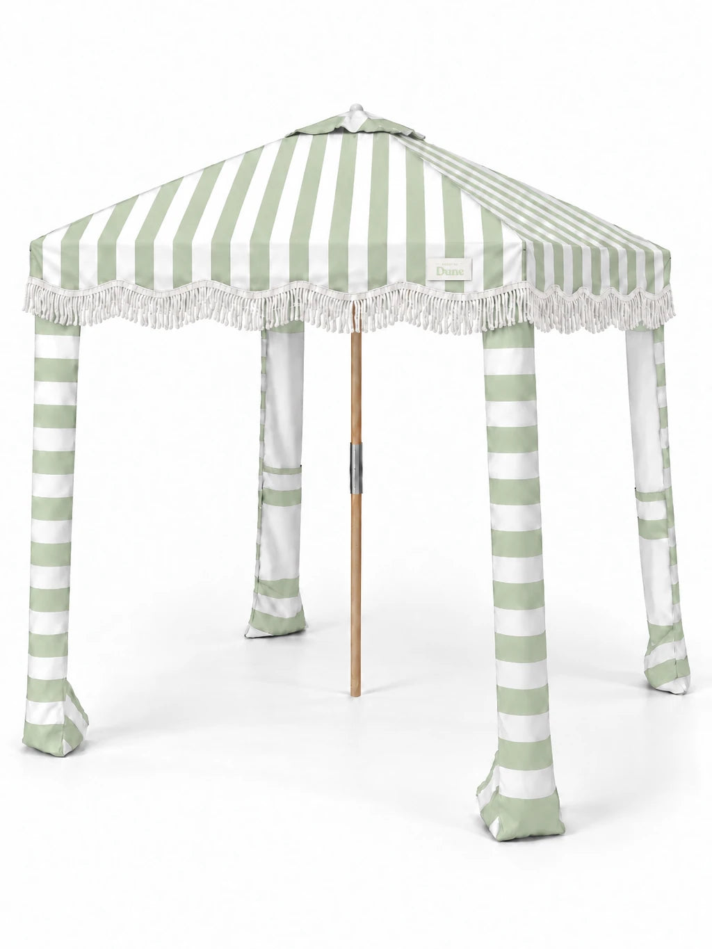 House of Dune Salted Sage beach cabana, three-quarter view on white: sage and white striped canopy with off-white fringe, striped fabric legs and wooden centre pole.