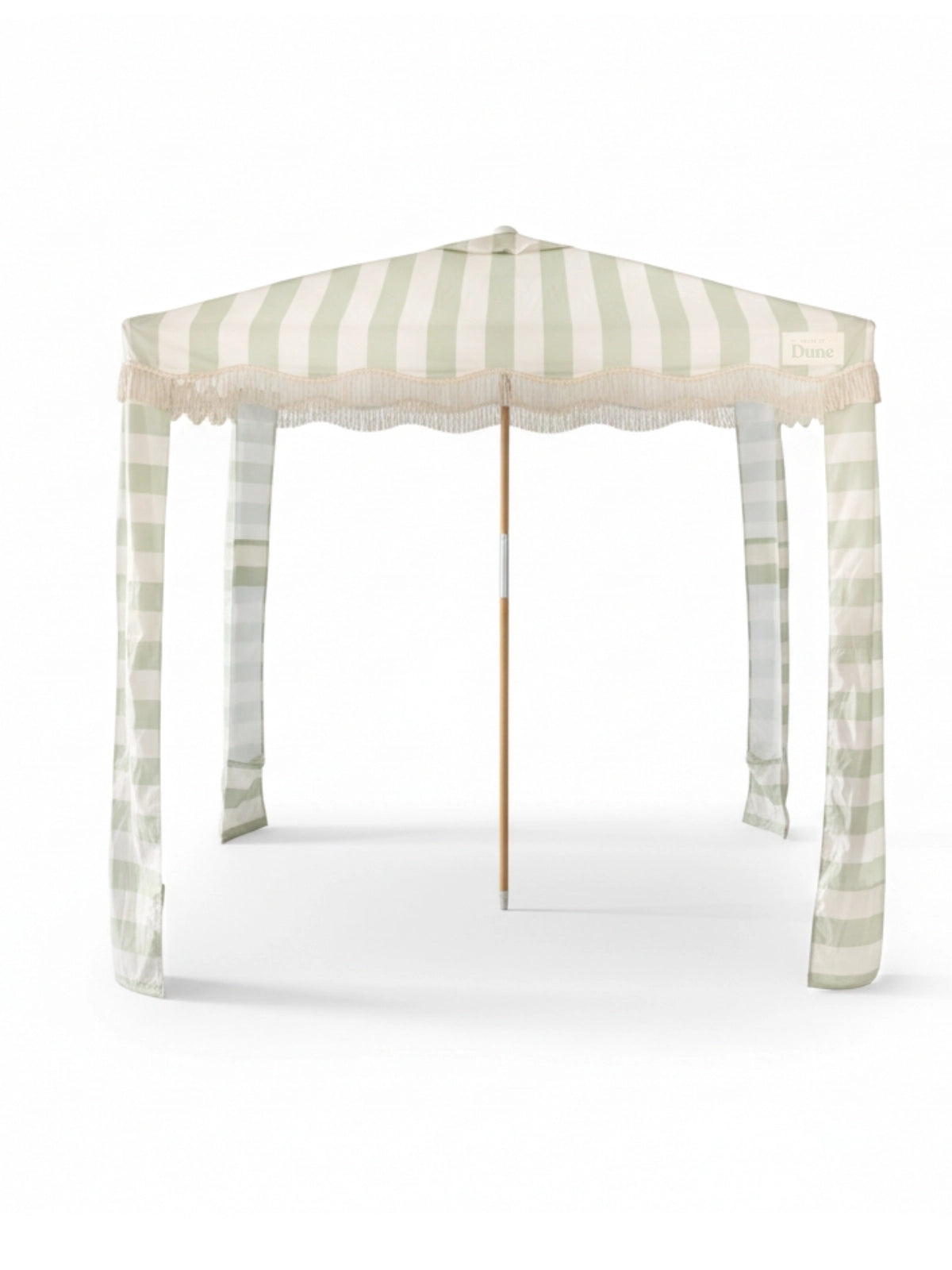 Upright Salted Sage cabana by House of Dune with striped canopy, fringe edging, and wooden pole frame.