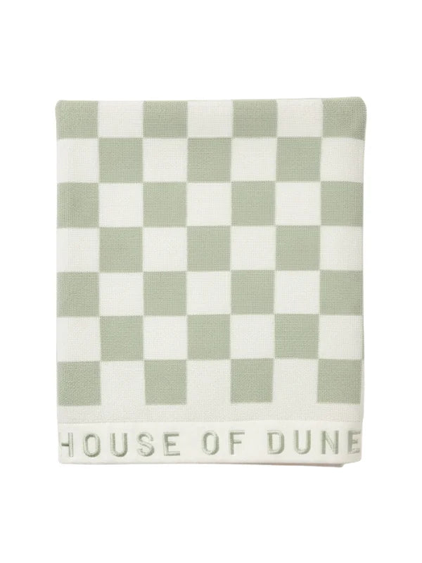 Folded Salted Sage checkered towel from House of Dune neatly displayed, highlighting its premium cotton texture and subtle branding.