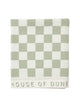 Folded Salted Sage checkered towel from House of Dune neatly displayed, highlighting its premium cotton texture and subtle branding.